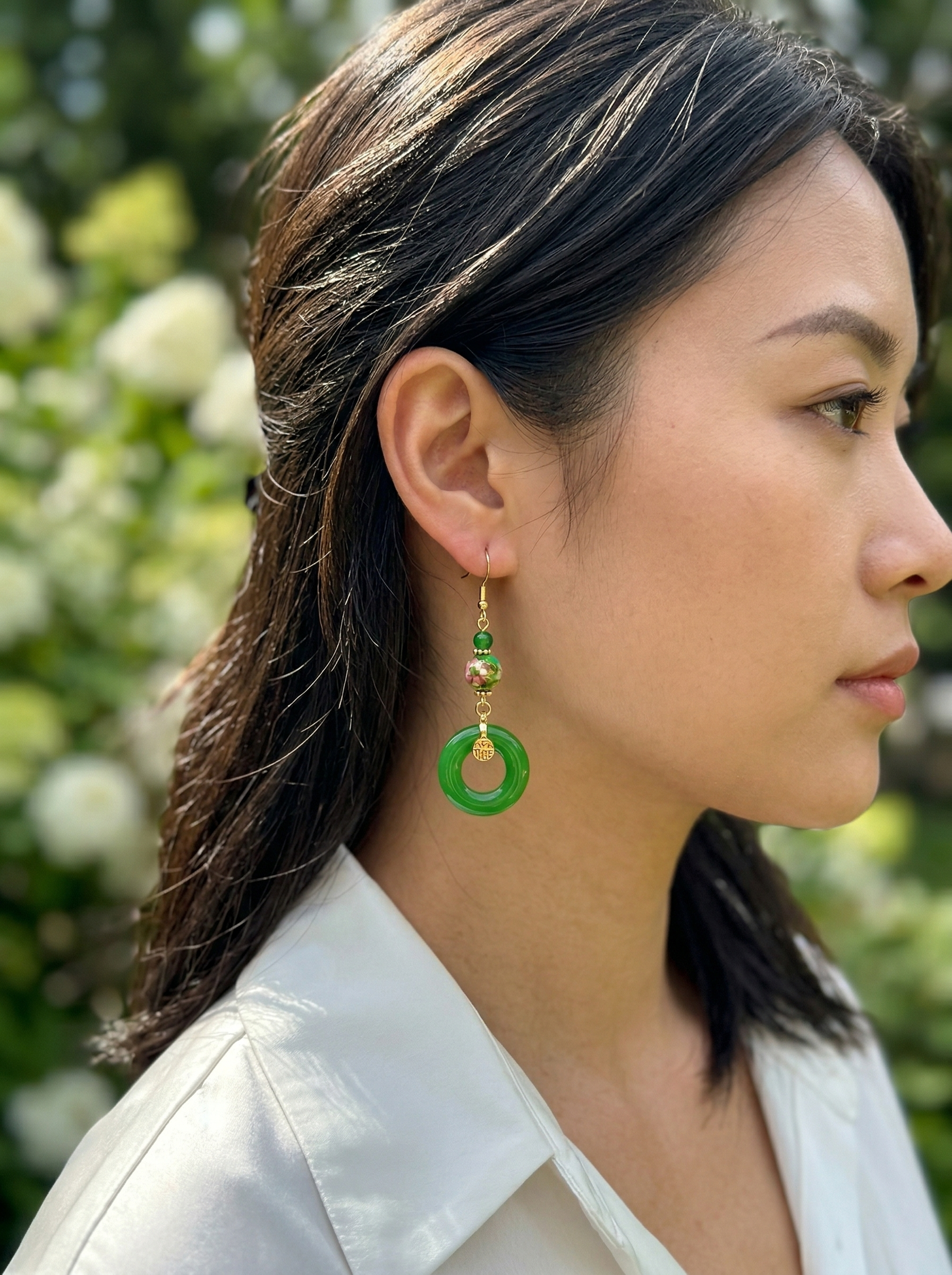 Side profile of a model wearing HECROWN 017 series green ceramic earrings. Showcasing the elegant Oriental aesthetic of handcrafted artisan jewelry.