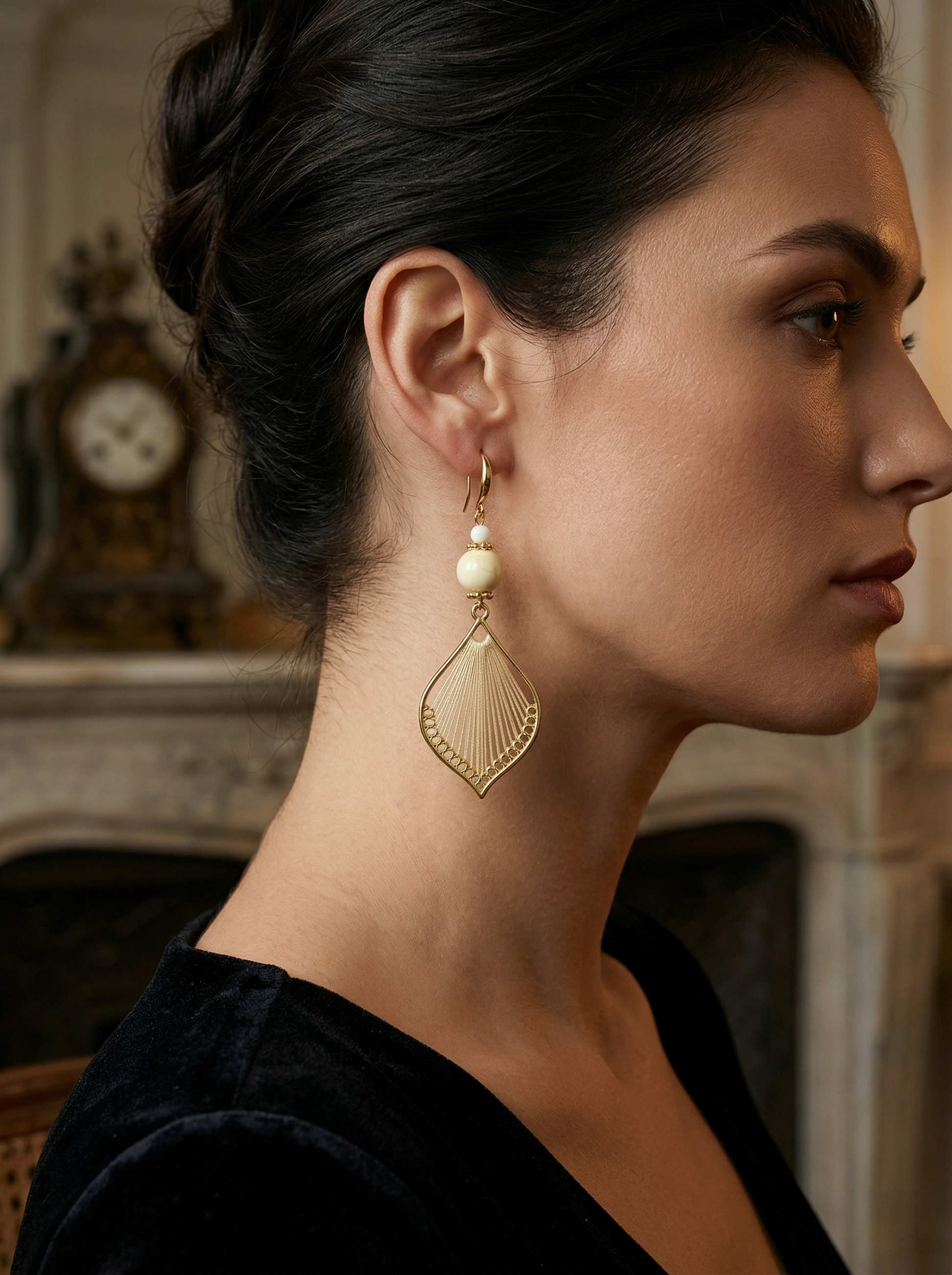 Side profile of a model wearing long HECROWN silk woven earrings. An elegant, lightweight statement jewelry piece for weddings or gifts.