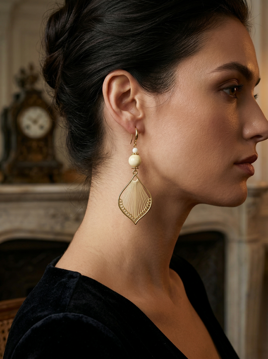 Side profile of a model wearing long HECROWN silk woven earrings. An elegant, lightweight statement jewelry piece for weddings or gifts.