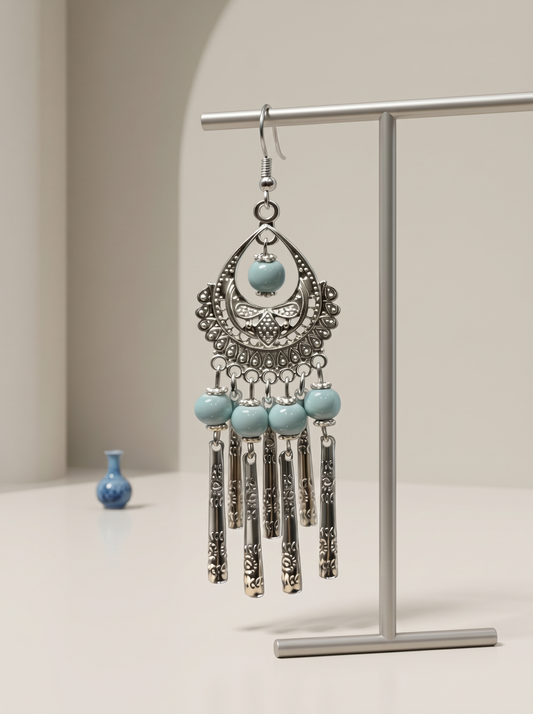 A pair of HECROWN 029 cobalt blue ceramic sphere earrings with hand-painted white floral dots. Sincere Jingdezhen handmade jewelry.