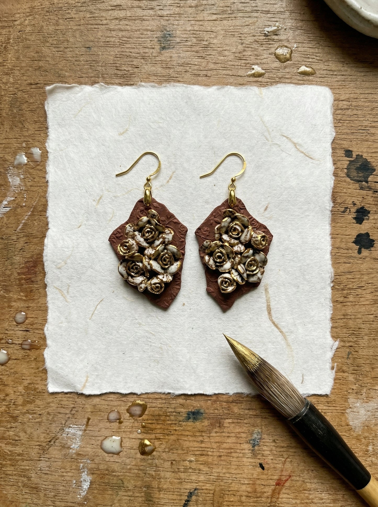 HECROWN 007 Ruined Rose ceramic earrings, a perfect anniversary gift. Hand-sculpted Jingdezhen porcelain featuring intricate roses, representing sincere handmade jewelry art.