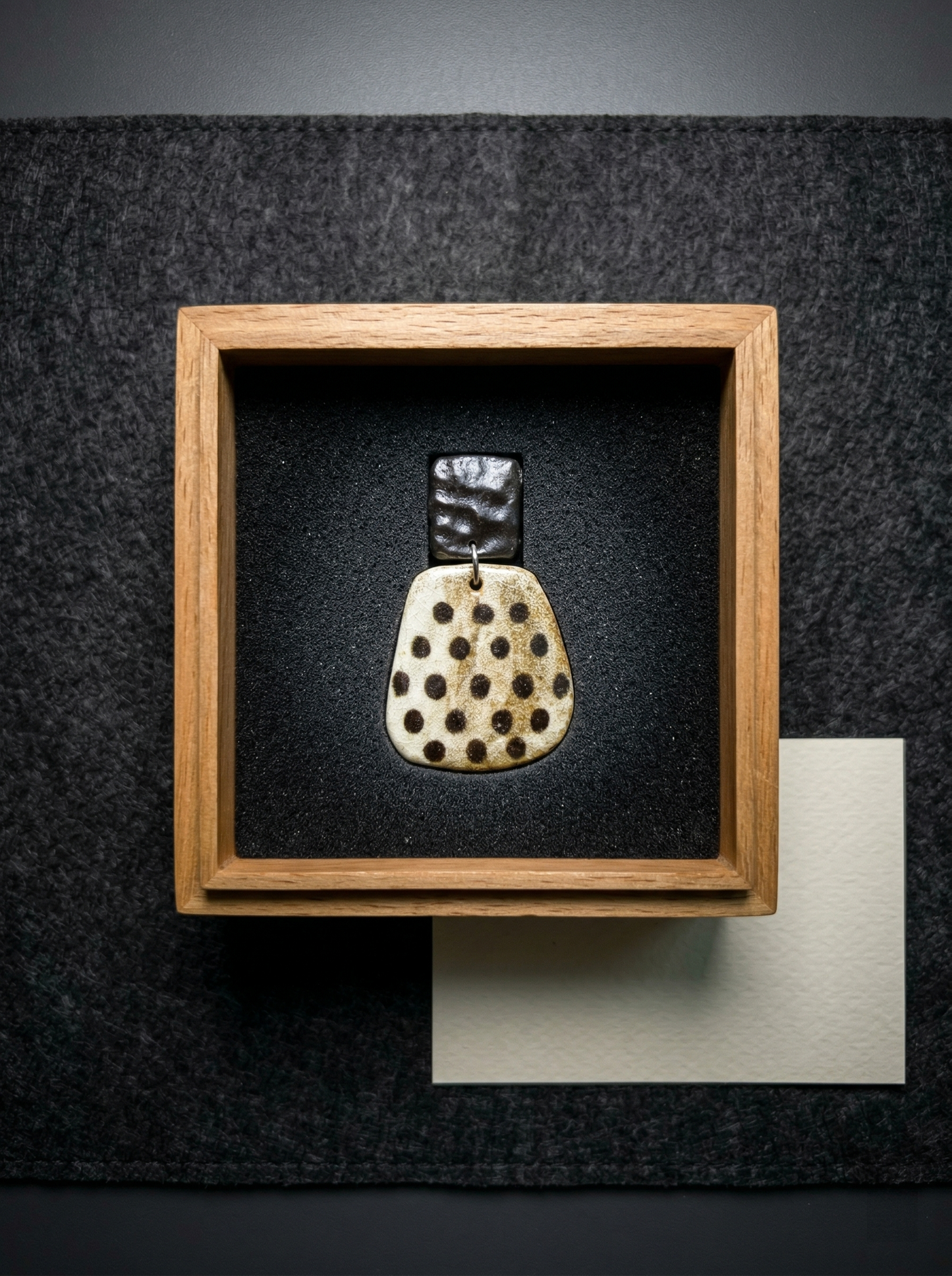 HECROWN speckled ceramic earring presented in a high-end wooden gift box with a blank card. A premium and unique anniversary gift for lovers of artisan jewelry.