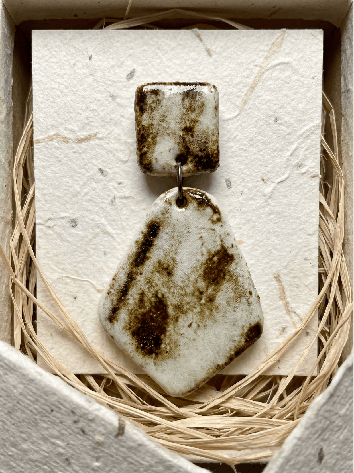 Sincere eco-friendly packaging of HECROWN wabi-sabi ceramic earrings. A unique handcrafted anniversary or Valentine's Day gift featuring authentic Jingdezhen porcelain jewelry.