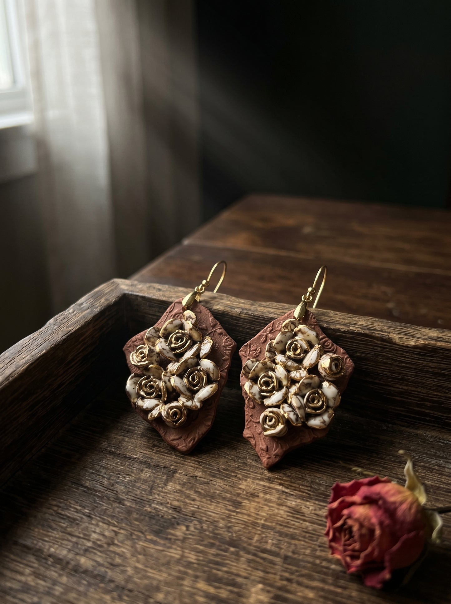 HECROWN 007 Ruined Rose ceramic earrings, a perfect anniversary gift. Hand-sculpted Jingdezhen porcelain featuring intricate roses, representing sincere handmade jewelry art.