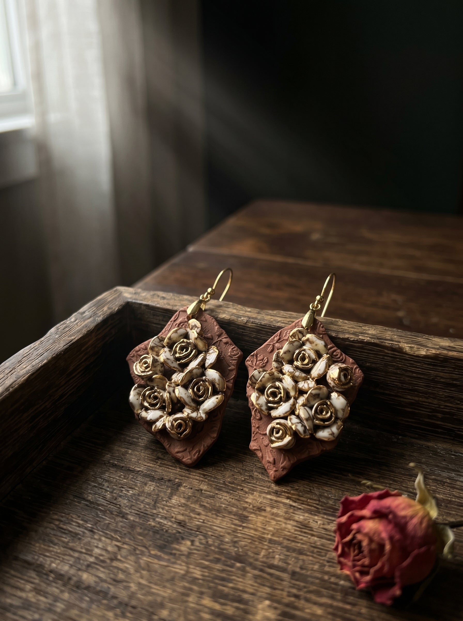 HECROWN 007 Ruined Rose ceramic earrings, a perfect anniversary gift. Hand-sculpted Jingdezhen porcelain featuring intricate roses, representing sincere handmade jewelry art.